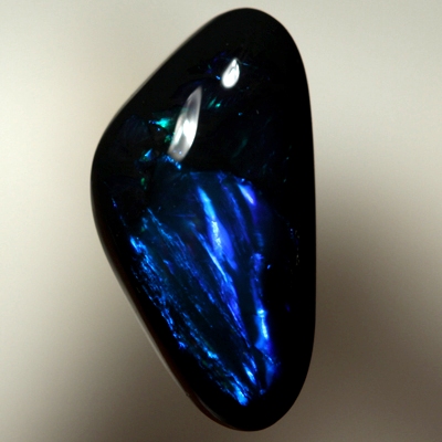 SOLID BLACK OPAL Rolling flashes of electric turquoise and peacock blue